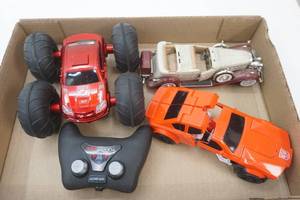lot 179 image: Tumble Bee Flip Stunt Rally Car, Diecast Cadillac, & Transformer