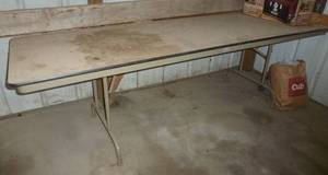 lot 19 image: 8 ft folding table and plastic round patio table