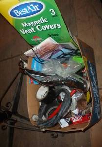 lot 71 image: Box with a faucet, hose, tape, electrical cord, vent covers, duct tape, hammer