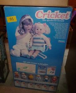 lot 91 image: Cricket doll with extra clothes and tape