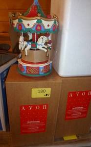 lot 186 image: 11 New boxed items - 2 house shaped ornament hangers, 2 angel soap dishes, 3 sets of 3 bear soaps on a bench, 3 wreaths, 2 carousels