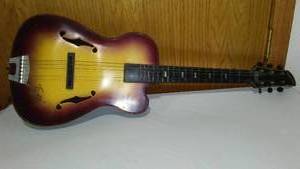 lot 657 image: Vintage Emenee Tiger Sunburst Guitar