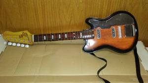 lot 658 image: TNE Nomura Tin Toy Guitar With Steel Strings, Japan