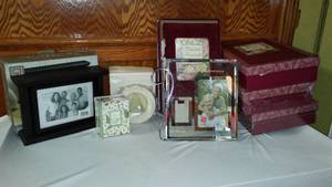 lot 708 image: NEW Revolving Photo Clock, Albums, Frames And More.