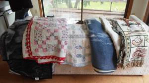 lot 752 image: Cabin Teardown Quits (2) And Blankets (4).