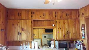 lot 764 image: Cabin Teardown   Kitchen Cabinets, Counter, Sink, Walls, Window, Stove, Ceiling Fan.