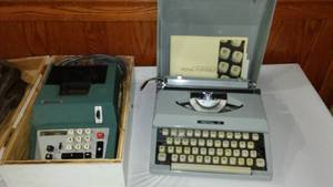 lot 717 image: Royal Portable Typewriter And Olivetti Adding Machine.