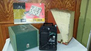 lot 734 image: Argus 300 Slide Projector, Bell And Howell Film Projector.