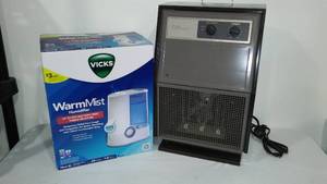 lot 801 image: Vicks Humidifier And Titan Heater