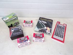 lot 28 image: Collectable Golf Car Cars, Clock, Book, Large Remote and Mustang GT Remote