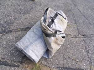 lot 61 image: Large Tarp may have holds or rips good for Wood Pile Gray