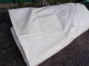 lot 62 image: Large Tarp may have holds or rips good for Wood Pile White