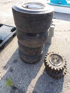lot 69 image: Golf Cart rims and tires and snow blower wheels