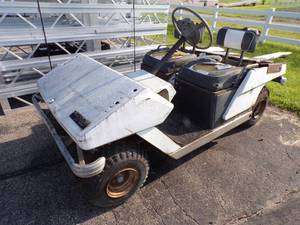 lot 77 image: Cushman Golfster Golf Cart for parts or repair