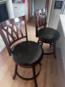lot 11 image: Stylish Rich Wood Finish Swivel Counter Chairs