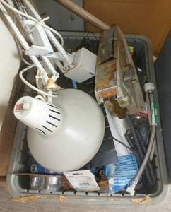 lot 48 image: tote full of misc items, lamp, faucet handles, etc