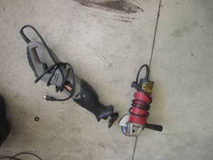 lot 111 image: Reciprocating saw and grinder, both...
