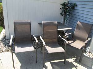 lot 28 image: Metal Patio table with 3-matching c...