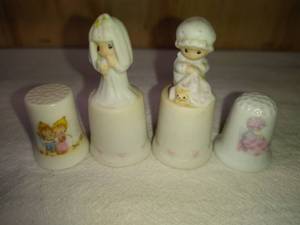 lot 97 image: 2 Precious Moments, 1 Enesco Love Covers All and 1 Enesco The Lord Bless You and Keep You Thimbles