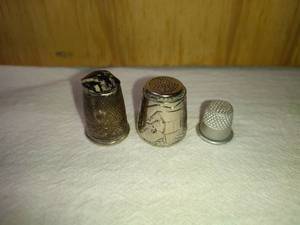 lot 158 image: 1 Ornate with Stone, 1 Wrapped with Sleigh and Covered Bridge Scene, and 1 Small Thimbles