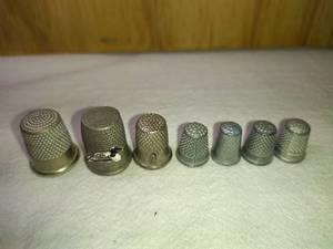 lot 163 image: 1 Simmons Nickel Silver, 1 Thread Cutter, 4 Pewter, and 1 Loon Thimbles