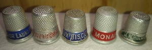 lot 184 image: 5 Assorted Advertising Metal Thimbles