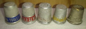 lot 185 image: 5 Assorted Advertising Metal Thimbles