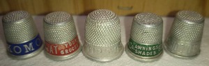 lot 187 image: 5 Assorted Advertising Metal Thimbles