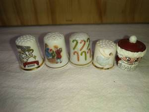 lot 85 image: 3 Ceramic Holiday, Roman Ballerina and Santa Pot Thimbles