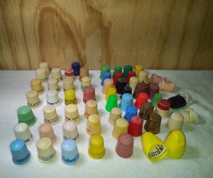 lot 86 image: 61 Plastic Plain and Advertising Thimbles Possibly Bakelite