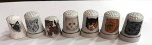 lot 28 image: Set of 7 Cat Themed Thimbles