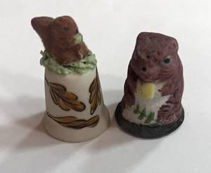 lot 36 image: Two Squirrel Thimbles