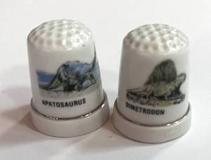 lot 38 image: Two Dinosaur Thimbles. Dimetrodon and Apatosaurus