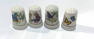 lot 6 image: Set of 4 Ceramic Butterfly Thimbles