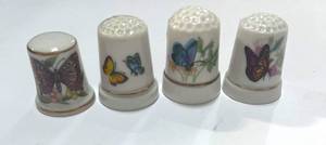 lot 43 image: Set of 4 Ceramic Butterfly Thimbles
