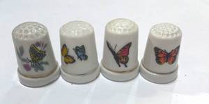 lot 5 image: Set of 4 Ceramic Butterfly Thimbles