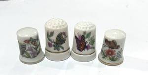lot 45 image: Set of 4 Ceramic Butterfly Thimbles