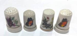 lot 47 image: Set of 4 Ceramic Butterfly Thimbles