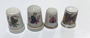 lot 49 image: Set of 4 Ceramic Butterfly Thimbles