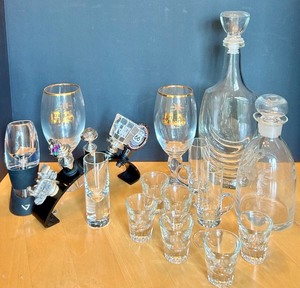 lot 60 image: Barware Set with Decanters, Glasses, Stella Artois Goblets, and Novelty Stoppers