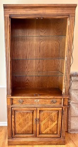 lot 85 image: Thomasville Lighted Wood Display Cabinet with Glass Shelves and Storage