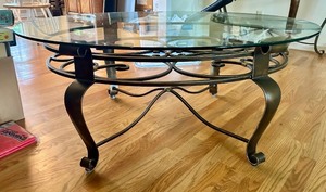 lot 130 image: Oval Glass Top Coffee Table with Metal Scrollwork Base
