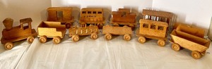 lot 211 image: Handcrafted Wooden Toy Train Set with 11 Cars