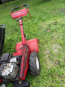 lot 15 image: Yard Machines Rear Tine Garden Tiller with 5HP Engine