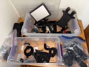 lot 102 image: Assorted Camera Mounts, Lighting, and Accessories Bundle