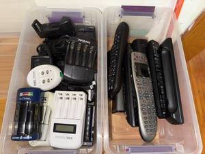 lot 105 image: Collection of Remote Controls and Battery Chargers with Charging Docks