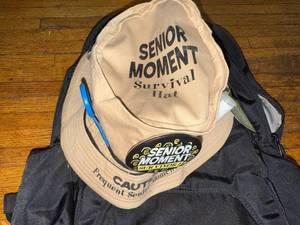 lot 106 image: Senior Moment Survival Hat with Accessories and Black Backpack
