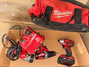 lot 278 image: Milwaukee M18 Cordless Drill, Impact Driver, Flashlight, Chargers, and Bag Set