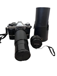 lot 94 image: Canon AE-1 Film Camera with Zoom Lens, Chinon Lens, and Case