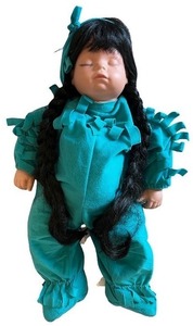 lot 211 image: Vintage Doll with Long Black Braided Hair and Turquoise Outfit